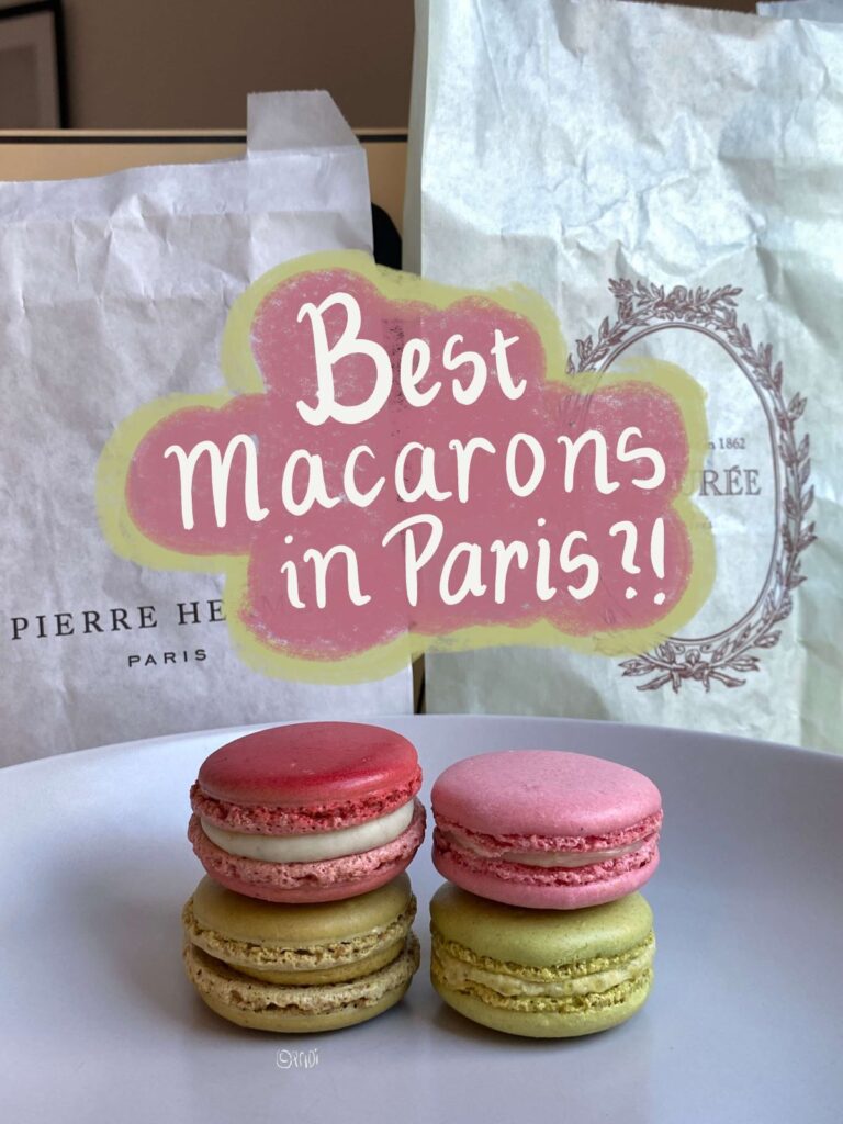 4 macarons from Pierre Hermé Paris and Maison Ladurée, stacked on top of each other, in front of the stores' paper bags