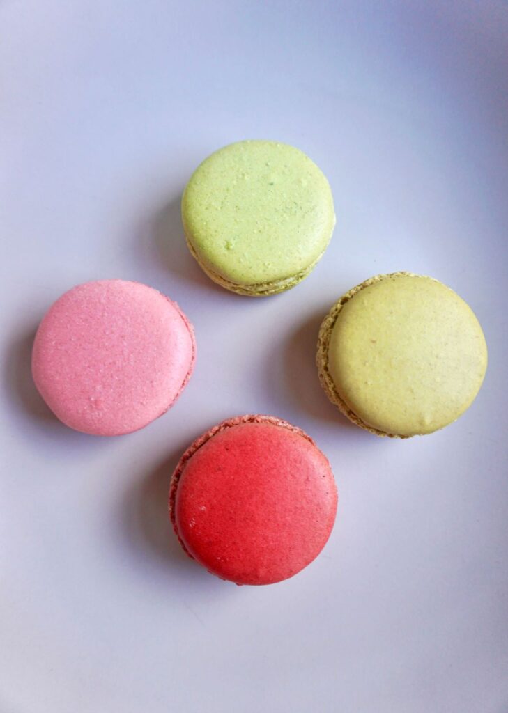 4 macarons arranged on a plate