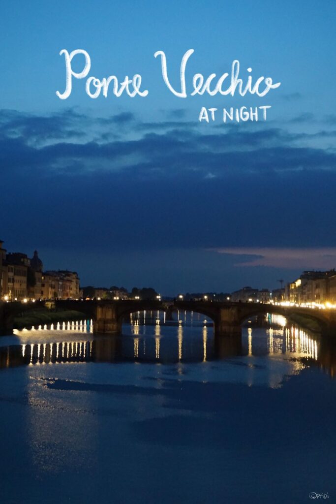 Ponte vecchio in Florence at night, lit up by lights