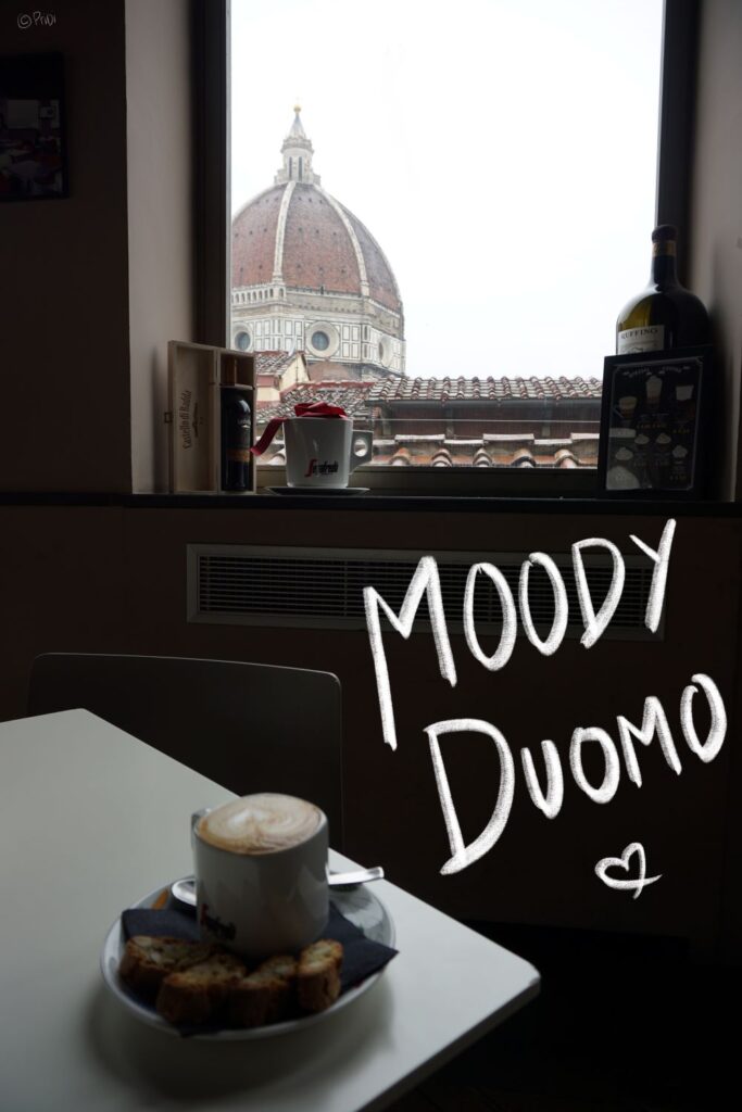 a cup of cappuccino and cantucci by the window overlooking the Duomo