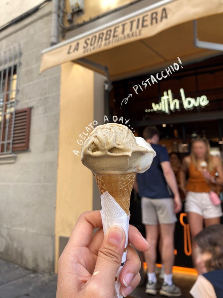 hand holding gelato in a cone at la sorbetteria florence