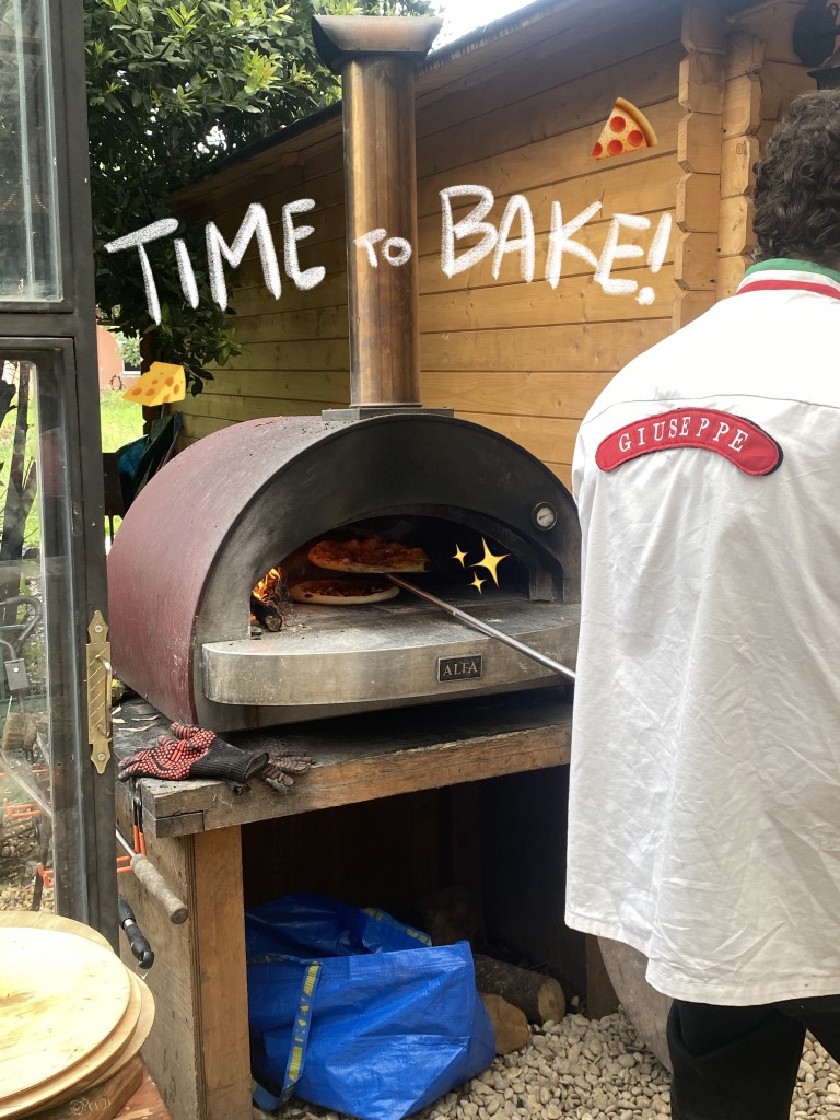 Pizza oven with "Time to Bake!" written on top