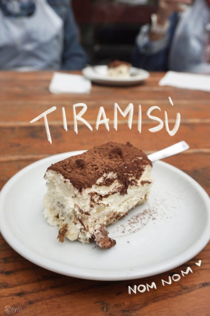 A plate of cocoa powder-covered tiramisu