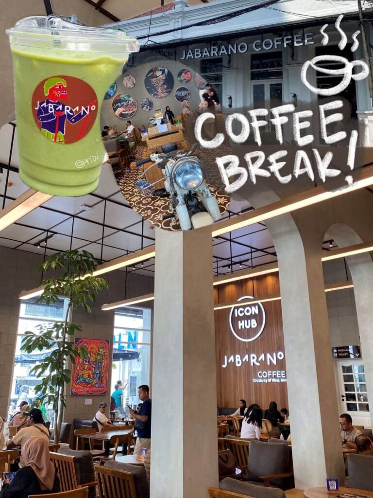 picture showing spacious and light interior of a cafe with a matcha latte