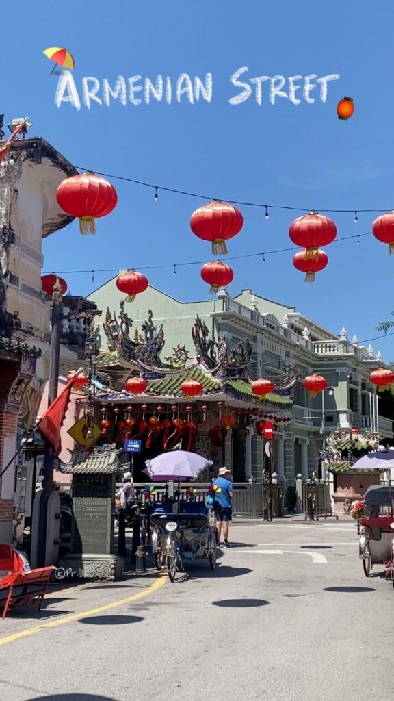 Malaysian street with temples and red Chinese lanterns hanging