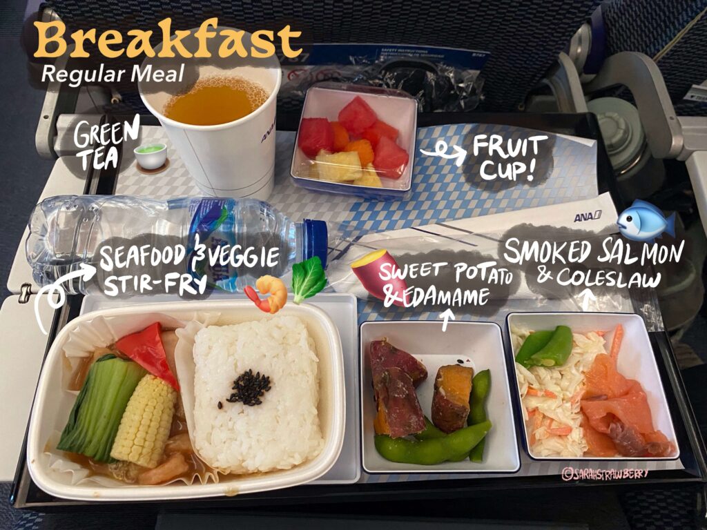 Breakfast ANA Airlines Japan Jakarta Tokyo, Seafood and vegetable stir fry, fruit plate, sweet potato with butter and soy sauce, edamame, smoked salmon and coleslaw