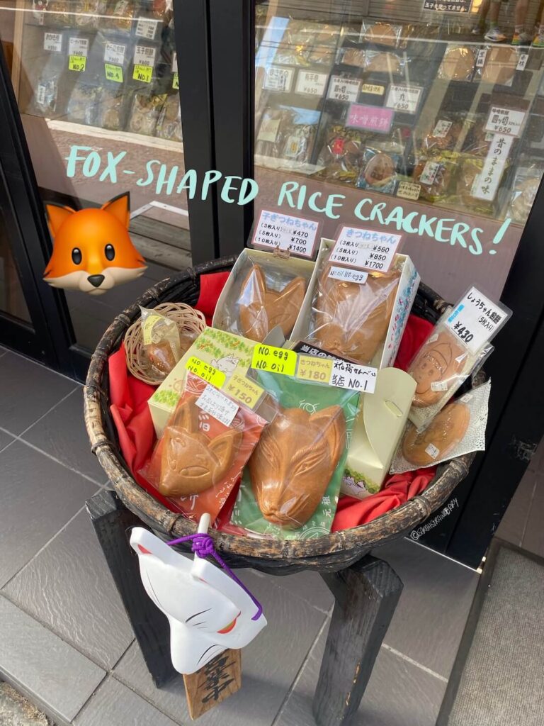 fox head shaped rice crackers in a Japanese storefront, store is Matsuya in Kyoto