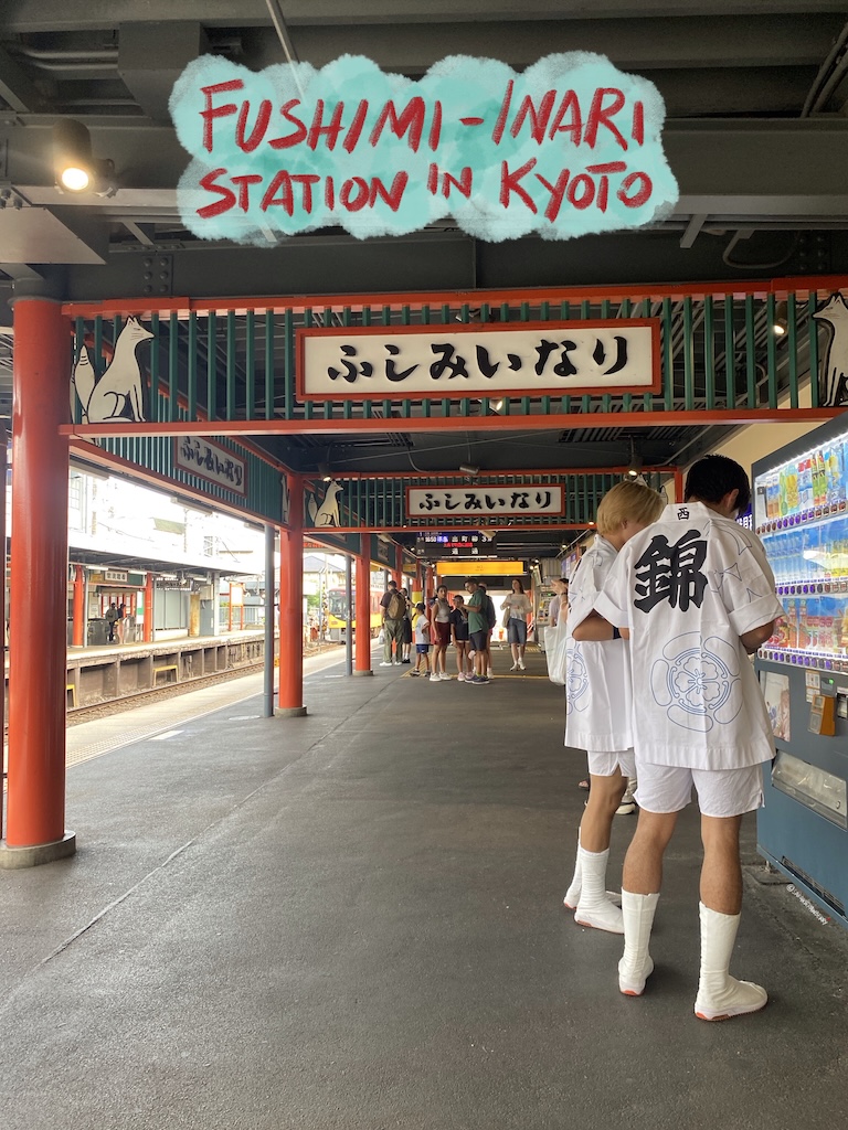 train station decorated with red torii temple gates