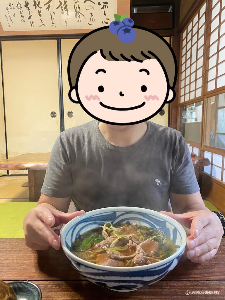 Boy eating duck noodle soup