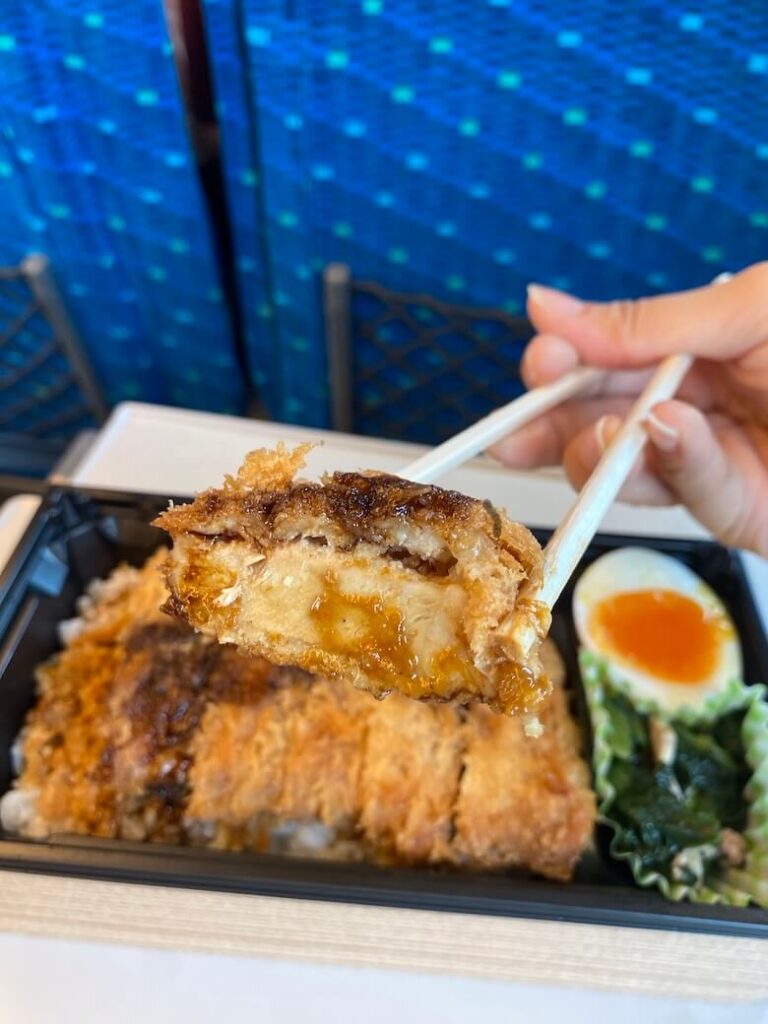 the inside of the chicken katsu covered with brown sauce