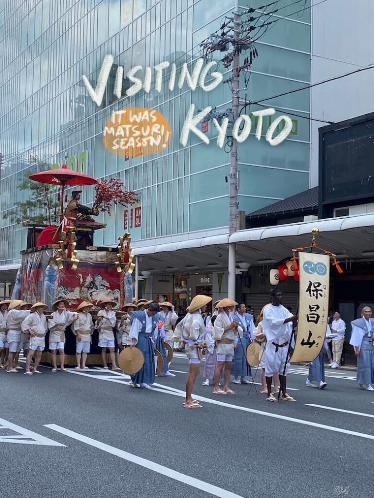 kyoto matsuri parade with a float containing deity statue and group of people in traditional attire pulling the float