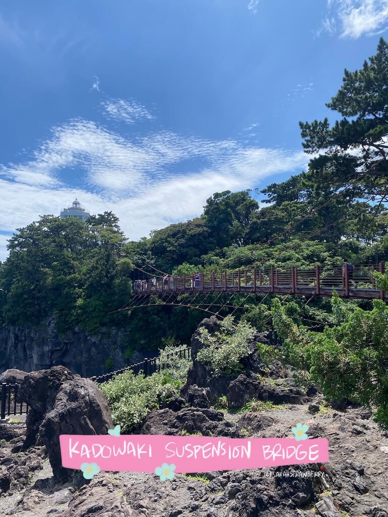 Suspension bridge view from afar, built between two rocky cliffs