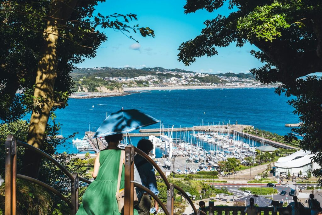 Two people gzing at the Enoshima Island seaview, Japan