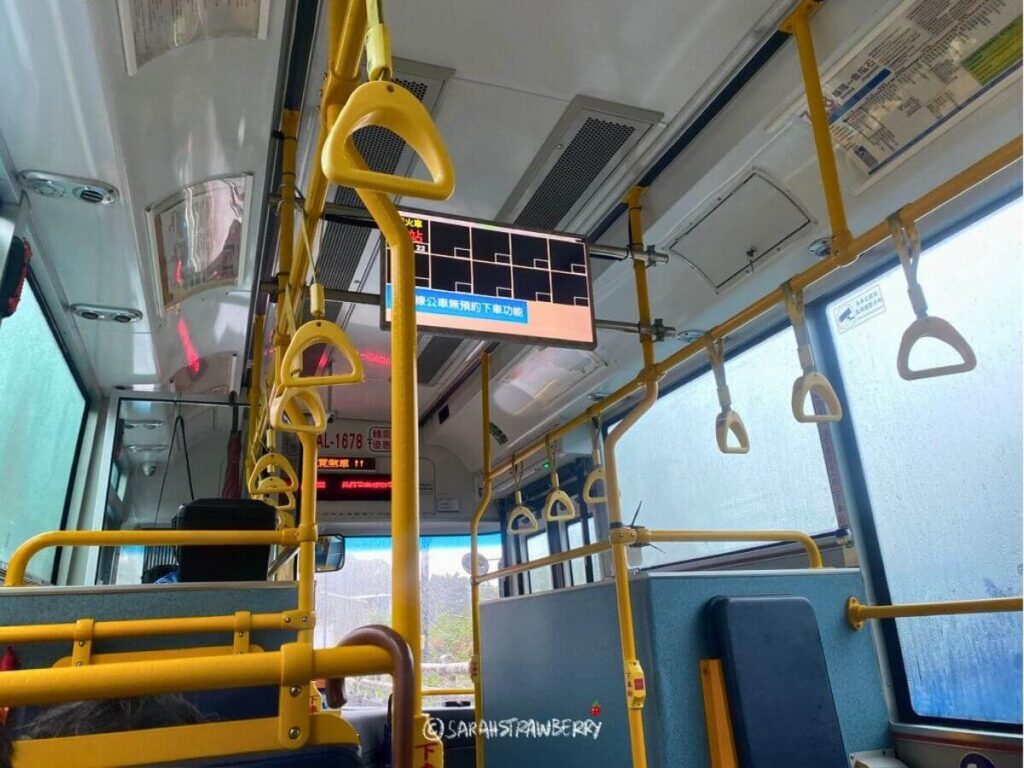 Taiwanese bus interior with yellow handles
