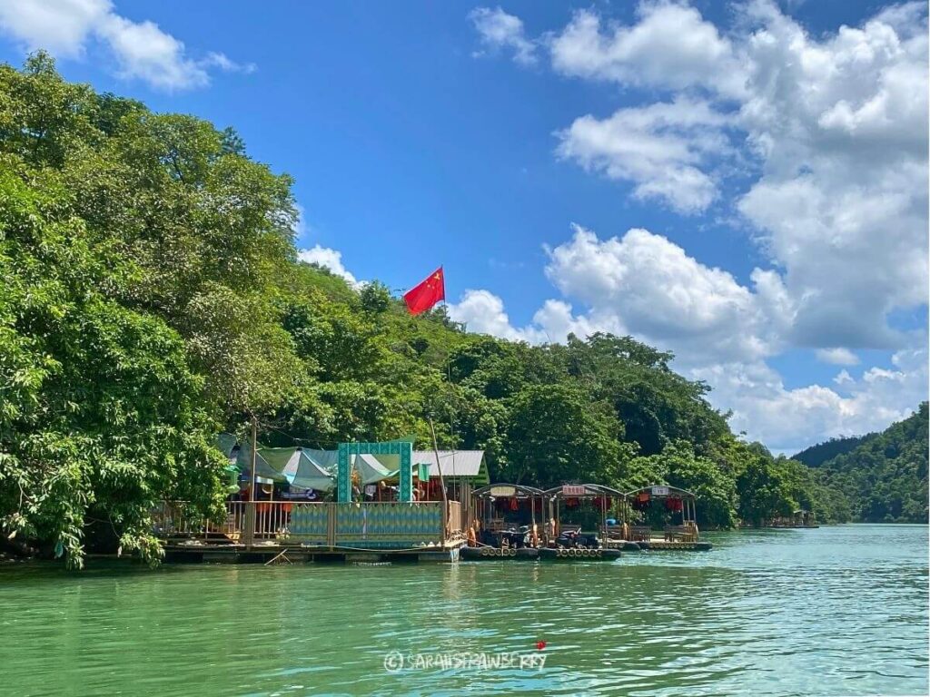 Chinese flag on the other side of the river! ban gioc waterfall vietnam cao bang loop