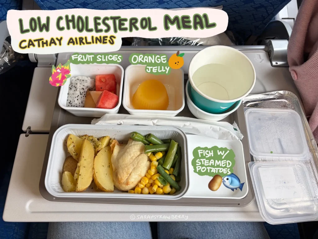 airplane low cholesterol meal; fish, corn, green beans, fruit cup, orange jelly, and some water