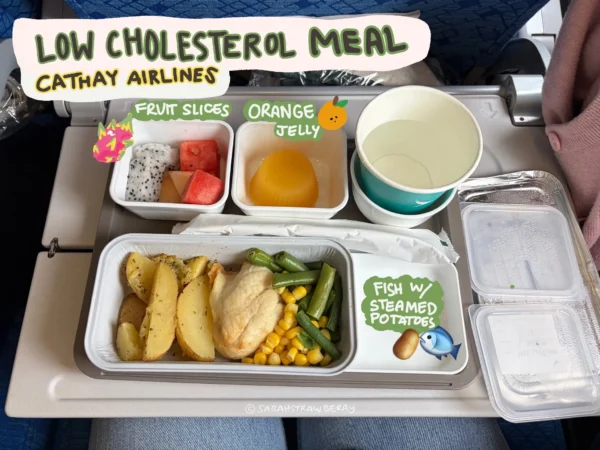 airplane low cholesterol meal; fish, corn, green beans, fruit cup, orange jelly, and some water
